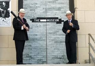 Las Vegas Mayor Oscar Goodman, left, and former Sen. Richard Bryan (D-Nev.) prepare to open the doors to the Mob Museum during a news conference at the museum site in downtown Las Vegas this morning. 
