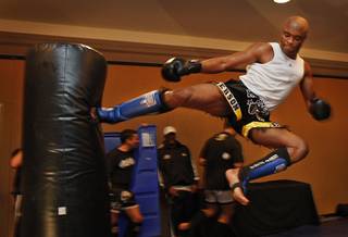 Fighters with the Ultimate Fight Championship hold workouts at the Loews Hotel in Center City Philadelphia on Wednesday afternoon August 5, 2009. Pictured is Anderson Silva, a light heavyweight fighting out of Curitiba, Brazil. He is shown flying through the air as he kicks a heavy bag.