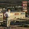 Greg Lee stands on a mesa overlooking his Eureka hotel and casino in Mesquite.