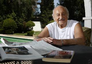 Professional sports bettor Lem Banker poses in his backyard Tuesday, August 18, 2009.