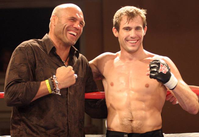 UFC legend Randy Couture, left, poses with his son, Ryan, after Ryan's main event victory over Jimmy Spicuzza at the Tuff-N-Uff event at the Orleans Saturday, Aug. 22, 2009.