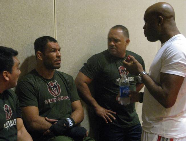 Antonio Rodrigo Nogueira (second from left) talks with UFC middleweight champ Anderson Silva (far right) and trainers during a workout Wednesday, August 26, 2009 at the Portland Marriott Downtown Waterfront in Portland, Ore. Nogueira takes on former UFC heavyweight champ Randy Couture at UFC 102 Saturday night at the Rose Garden Arena.
