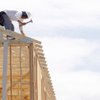 A carpenter frames a home under construction in Henderson in this 2009 file photo.