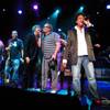 Comedian Drew Carey, center, joined the Lon Bronson All-Star band onstage Aug. 27, 2009, at Ovation Lounge in Green Valley Ranch. Carey helped sing backup on the band's final number of the night, The Monkees' hit "(I'm Not Your) Steppin' Stone."