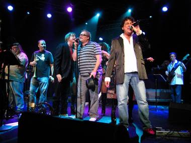 Comedian Drew Carey, center, joined the Lon Bronson All-Star band onstage Aug. 27, 2009, at Ovation Lounge in Green Valley Ranch. Carey helped sing backup on the band’s final number of the night, The Monkees’ hit “(I’m Not Your) Steppin’ Stone.”