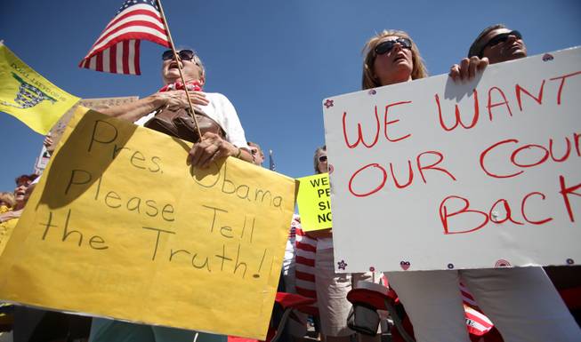 Hundreds participate in the "Tea Party Express" rally Monday at the Las Vegas Sports Center. The Tea Party Express is organizing rallies in several cities to voice its opposition to the policies of President Barack Obama, Sen. Harry Reid and other leaders. 