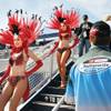 
Showgirls Jenee Brown, left, and Darci Burke head to the Neon Garage to pose for photos before the March 1 NASCAR Sprint Cup Series race in Las Vegas.