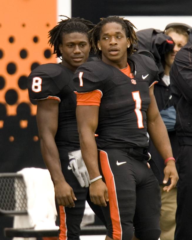 Brothers Jacquizz Rodgers, right, and James Rodgers watch from the sidelines during the second half of their 34-7 victory over Portland State in Corvallis, Ore., on Saturday. Both did equal amounts of damage, and both will deserve equal attention when they come to face UNLV on Saturday at 8 p.m.