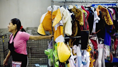 Workers at Goodwill warehouse sort through the good, bad, weird