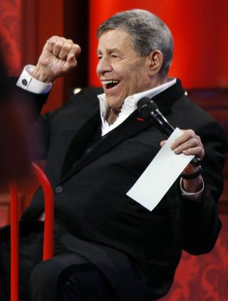 Jerry Lewis reacts happily to a tally update.