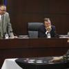 State Gaming Control Board Chairman Dennis Neilander, left, and member Randall Sayre watch as George Boutsifakos demonstrates "Two Cards High," a new casino game, at a Gaming Control Board meeting Thursday, September 3, 2009. 
