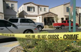 Metro Police investigate at the scene of an apparent murder-suicide at 1292 Sun Village Ave. Monday, September 14, 2009. 