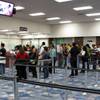 Travelers from an international flight wait in line at the passport check area at McCarran International Airport's Terminal 2 on Wednesday, April 23, 2010.