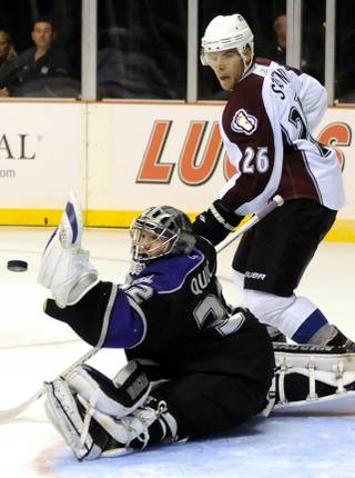 Colorado center Paul Stastny (26) waits for a possible rebound as Los Angeles Kings goaltender Jon Quick deflects a shot with his glove during Frozen Fury XII at the MGM Grand Garden Arena on Saturday night.