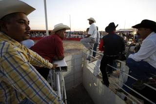 Mexican cowboys wait for the next bull rider during a Hispanic Cultural Events Rodeo at rodeo grounds by the vacant Roadhouse Casino on Boulder Highway near Sunset Road in Henderson Sept. 26, 2009. The rodeo was the first of what is to be a weekly rodeo held from 3 p.m. to 9 p.m. each Saturday through Oct. 17. 
