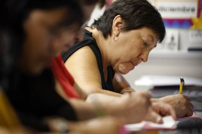 Maria De Jesus Esparza Castillo, 57, works on a writing exercise during a free class Tuesday, Sept. 22, 2009. A school district program with private foundation money uses Mexican government-supplied materials to teach functionally illiterate parents to read and write in Spanish. 