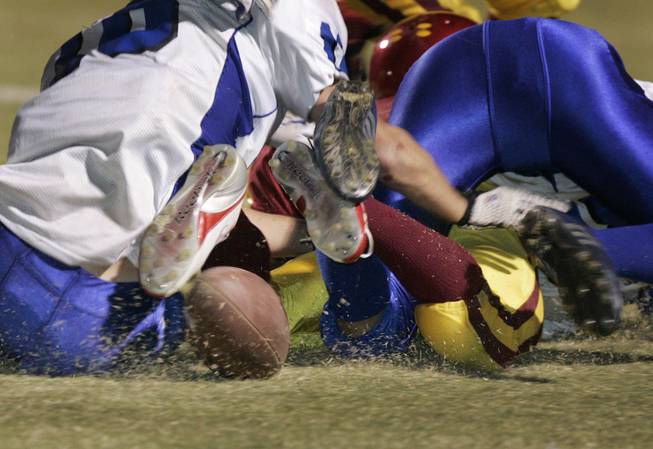 The ball bounces loose during a turnover-plagued game between Del ...