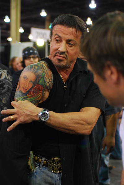 Sylvester Stallone reveals his shoulder tattoo at The Biggest Tattoo Show on Earth.