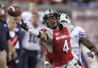 UNLV wide receiver Phillip Payne reaches for an Omar Clayton pass against BYU on Oct. 10, 2009, at Sam Boyd Stadium.