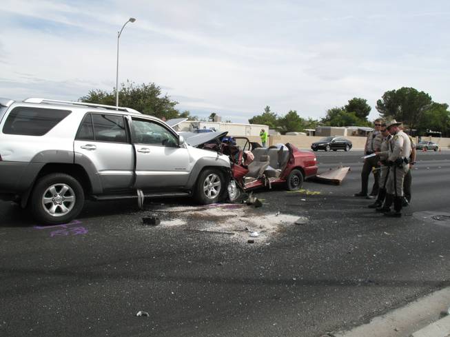 Metro Police investigate a car crash near the intersection of Jones Boulevard and Tropicana Avenue. The accident occurred at about 12:15 p.m. on Tuesday.