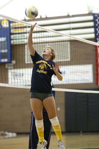 Senior Paxton Fleming tips the ball over the net Monday during volleyball practice at Boulder City High School.
