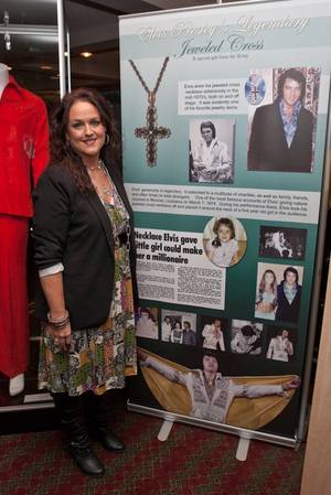 Rhonda Williams pictured with the necklace Elvis gave her at a concert in 1974 on display at King's Ransom Museum's Elvis Presley exhibit at the Imperial Palace. 