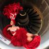 Getting to London: A showgirl appears in the engine cowling of a British Airways aircraft as part of a campaign to promote the airline's new Las Vegas flight. 