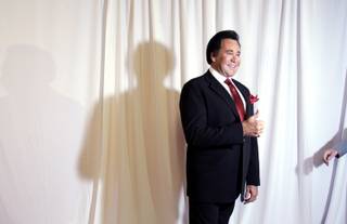LAS VEGAS - WEDNESDAY, OCTOBER 28, 2009 - Wayne Newton appears on the red carpet as a handler reaches for him to move on during the grand opening night of Wayne Newton's 