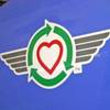 Southwest Airlines' "green plane," a Boeing 737 jet featuring environmental extras, bears a special Southwest recycling symbol with a heart and green arrows atop a set of flight wings.
