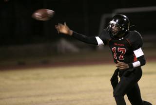 Las Vegas High quarterback Hasaan Henderson throws a pass during the game against Desert Pines Thursday night.  Las Vegas pulled out a 7-6 victory.