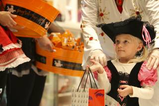 Little Miss Pirate Natalie Freer, 3, trick-or-treats during the Halloween celebration for children and families of the Nevada Childhood Cancer Foundation hosted by the Sugar Factory at the Mirage.