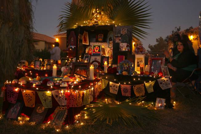 As the sun begins to set, candles and twinkling lights illuminate the altars in memory of deceased relatives or other beloved individuals during the annual Life in Death: Day of the Dead Festival Sunday night at the Winchester Cultural Center and Park.