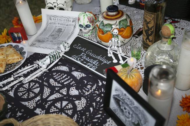An altar in memory of Jose Guadalupe Posada, a Mexican engraver, illustrator and artist, is presented by Beatriz Parra at the annual Life in Death: Day of the Dead Festival Sunday night at the Winchester Cultural Center and Park.
