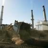 A payloader mixes wood chips with coal at NV Energy's Reid Gardner Station coal-fired power plant Wednesday, Nov. 4, 2009 near Moapa.  