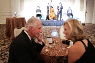 Donor Jon Cobain, the first graduate of UNLV in 1964, talks with his wife Judy Flynn at cocktail hour during the UNLV Foundation Annual Dinner at the Bellagio on Thursday.