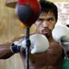 Manny Pacquiao of the Philippines hits a double-end bag during a workout at the Wild Card Boxing Club in Los Angeles Wednesday, Nov. 4, 2009. Pacquiao will challenge WBO welterweight champion Miguel Cotto of Puerto Rico for the title at the MGM Grand Garden Arena on Nov. 14. 