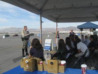 Metro police officer Richard Strader with the traffic bureau speaks to Faith Lutheran High School students about the deadly consequences of driving distractions during Allstate Insurance's Action Against Distraction Challenge on Tuesday at the Las Vegas Motor Speedway.
