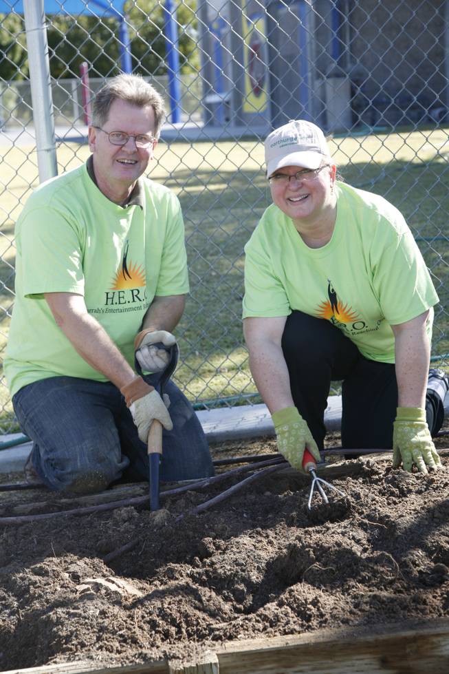 Second grade teacher Fred Koopmann and volunteer Ellen Guise, an IT business analyst for Harrah's Entertainment, work to make an edible garden for George E. Harris Elementary School students. The event was part of Nevada's Make a Difference Day.