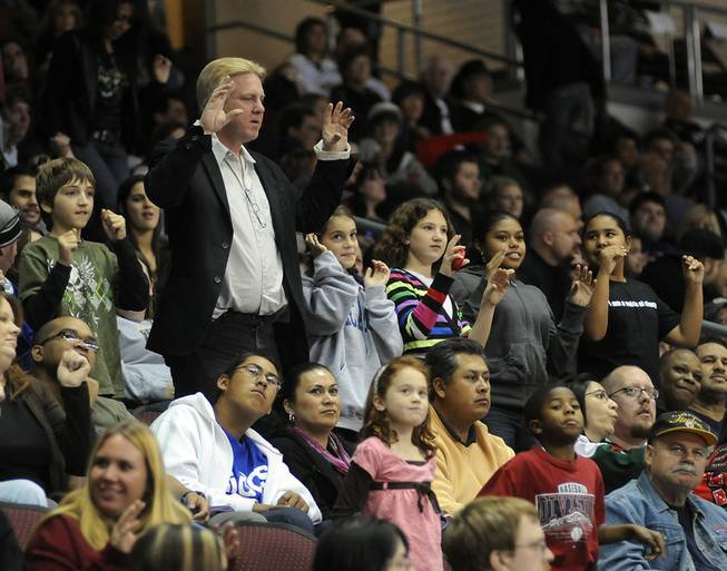 Fans perform the chicken dance during a stoppage in play at the Orleans Arena on Friday, Nov. 13, 2009. Over 6,000 attended the game between the Wranglers and the visiting Utah Grizzlies.