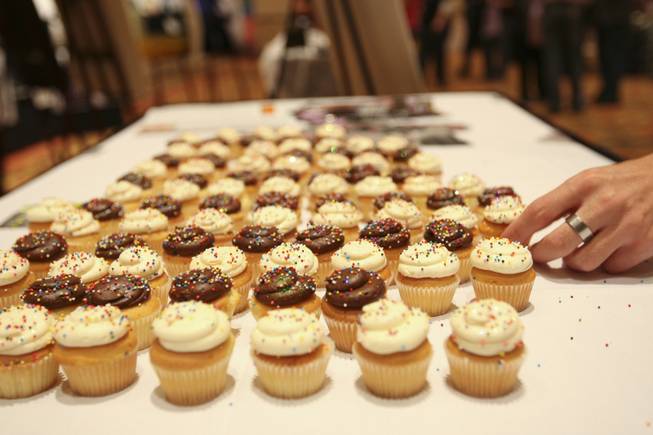 Sprinkled cupcakes tease event-goers to QVegas Magazine's booth during the ...
