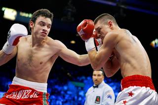 Julio Cesar Chavez Jr., left, of Mexico connects with a punch on Troy Rowland during a middleweight bout at the MGM Grand Garden Arena November 14, 2009.