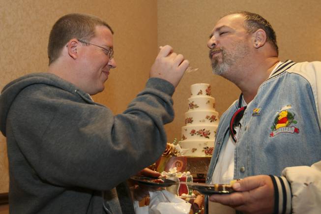 Four-year partners Michael Kutan and Gary Capone, right, sample flavors ...
