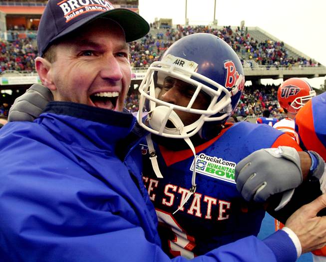 Dirk Koetter, left, celebrates with safety Shaunard Harts after Boise State defeated UTEP in the Humanitarian Bowl, 38-23, on Dec. 28, 2000. Koetter is currently the offensive coordinator for the NFL's Jacksonville Jaguars, but his name has floated around in relation to the vacant UNLV head coaching post.