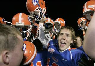 Bishop Gorman kicker Colin Ditsworth celebrates with teammates after the Gaels beat Cimarron-Memorial in the Sunrise Division championship game Friday. Bishop Gorman won the game, 31-7, to advance to the state semifinals.