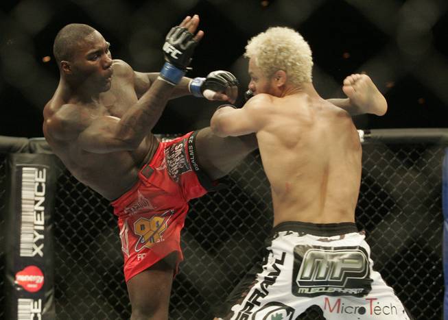 Anthony Johnson, left, kicks at Josh Koscheck during UFC 106 Saturday, November 21, 2009 at the Mandalay Bay Events Center.