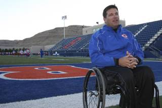 Freshmen linebacker coach Adam Hutchins talks about the leadership of head coach Tony Sanchez and the success of the football program Monday during practice at Bishop Gorman High School.