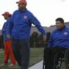 Bishop Gorman High freshmen football coaches Adam Hutchins, right, and Rod Burgman share a laugh Monday during the Gaels' varsity team's practice in preparation for Saturday's state semifinals against host Reed High of Sparks.

