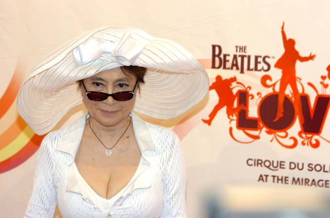 Yoko Ono, wearing a Stella McCartney hat and pantsuit, before the gala premiere of "Love" in June 2006.