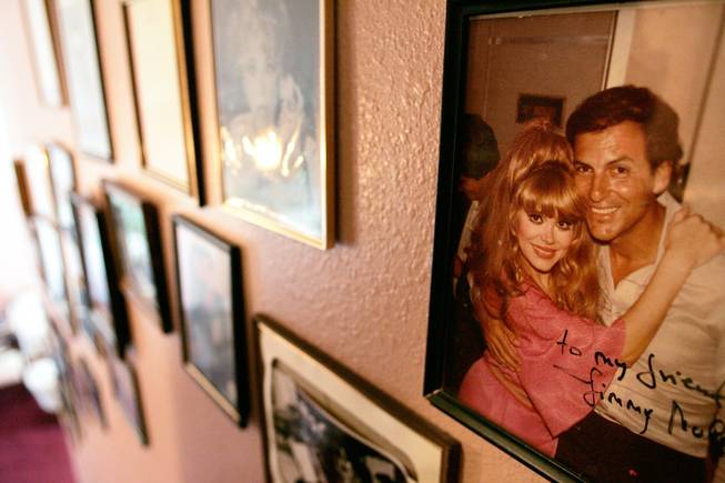 Mulidore, who served as musical director of the Hilton and the Flamingo, poses with performer Charo in this early 1980s photograph in his home.