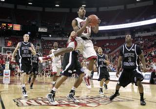 UNLV guard Justin Hawkins glides in for a basket against Holy Cross during the second half of the team's Nov. 25 game at the Thomas & Mack Center. UNLV won, 80-59, as Hawkins tallied 12 points.